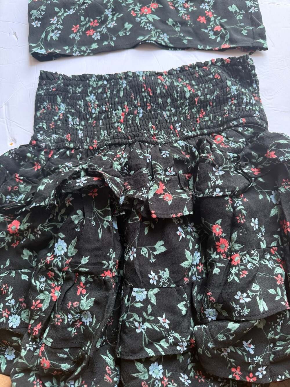 Olivaceous Black Floral Two-Piece Set with Smocked Ruffle Skirt and Crop Top